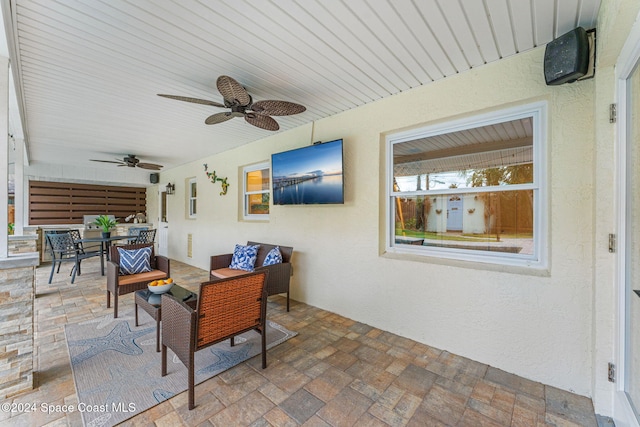 view of patio featuring ceiling fan