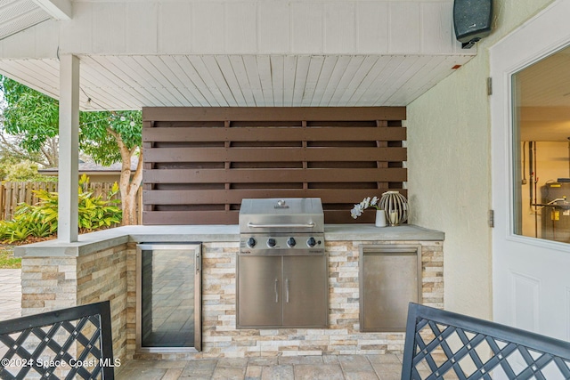 view of patio / terrace featuring a grill and exterior kitchen