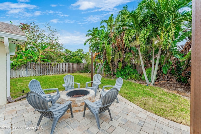 view of patio / terrace featuring an outdoor fire pit