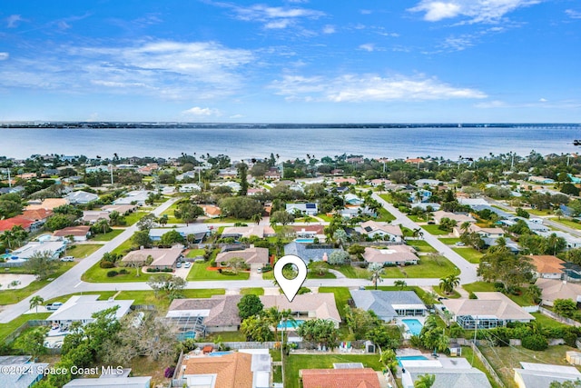 drone / aerial view with a water view