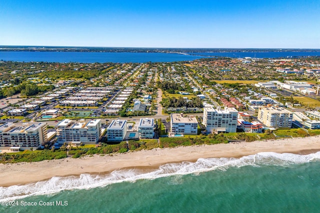 birds eye view of property featuring a view of the beach and a water view