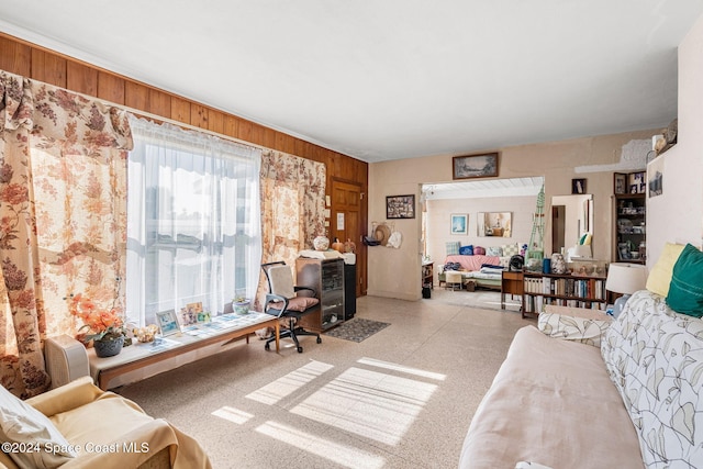 living room featuring wooden walls