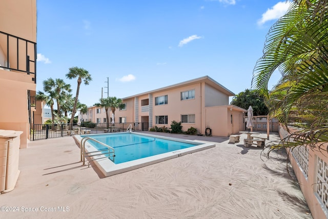 view of swimming pool with a patio