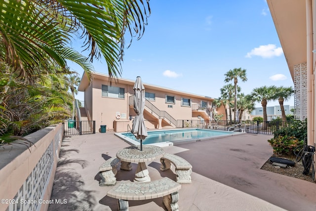 view of swimming pool with a patio area