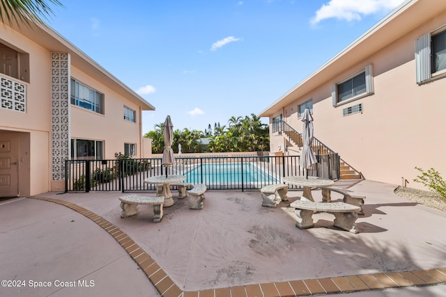 view of swimming pool featuring a patio area