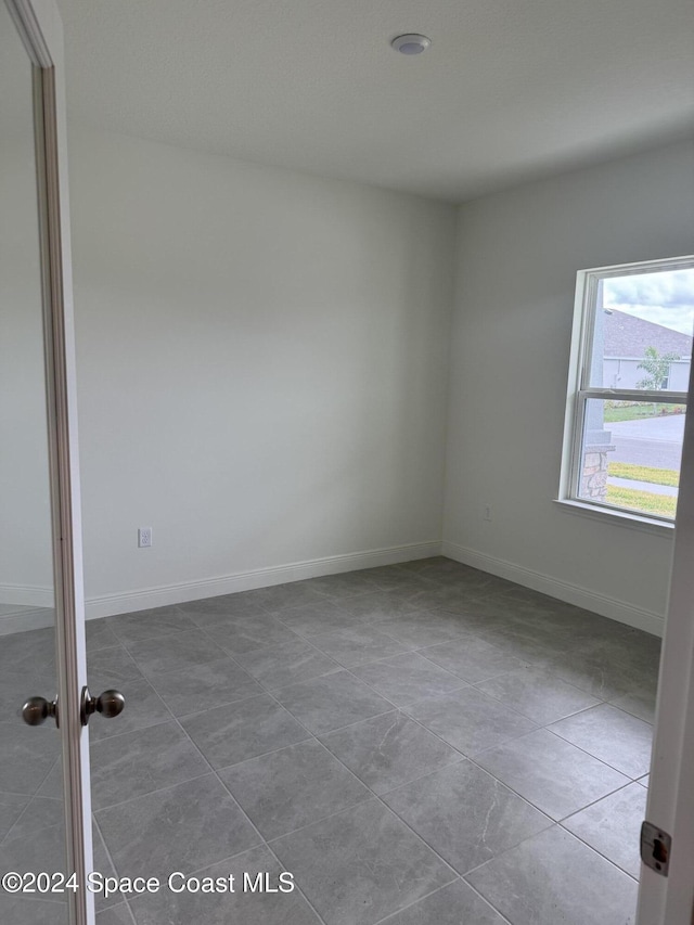 view of tiled empty room