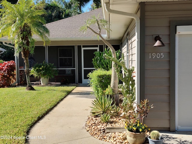 entrance to property with a yard