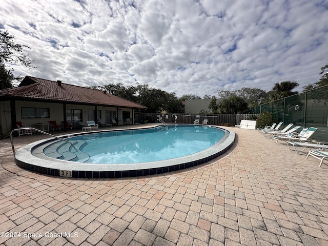 view of pool featuring a patio