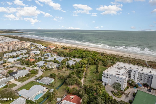 drone / aerial view with a water view and a view of the beach