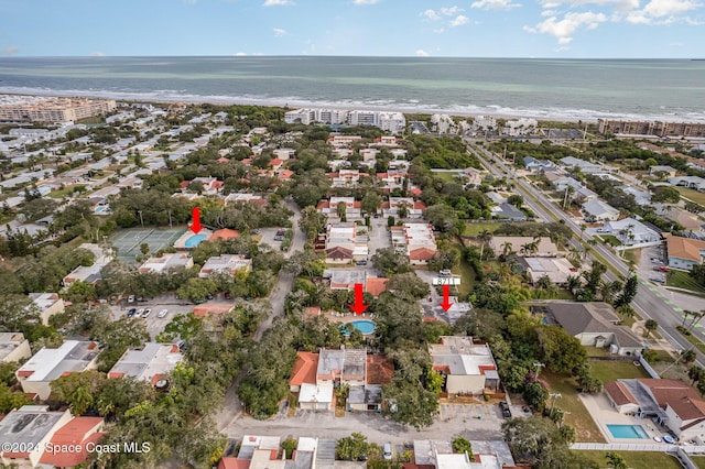 bird's eye view featuring a beach view and a water view