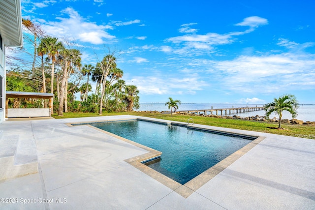 view of swimming pool with a water view and a patio area