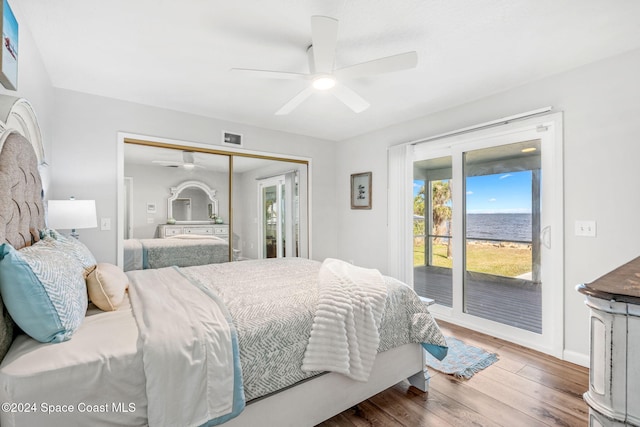 bedroom with ceiling fan, hardwood / wood-style flooring, a closet, and access to outside