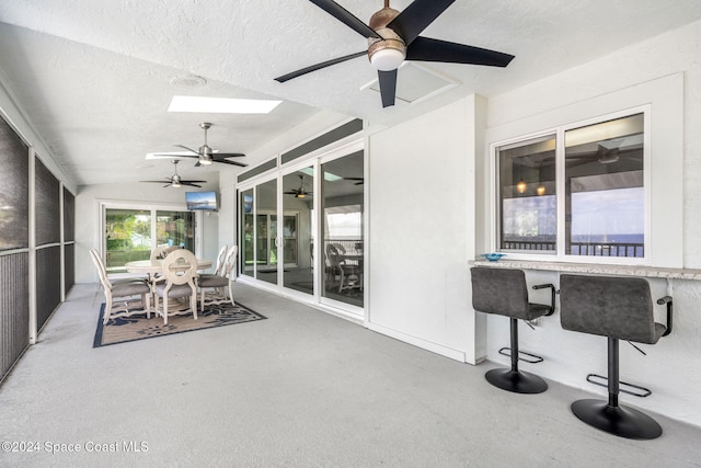 sunroom / solarium featuring a skylight