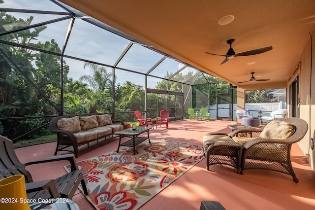 view of patio / terrace featuring outdoor lounge area, ceiling fan, and a lanai