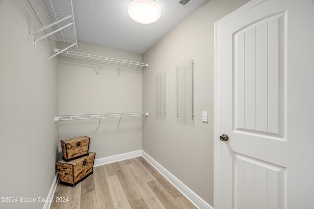 walk in closet featuring light wood-type flooring