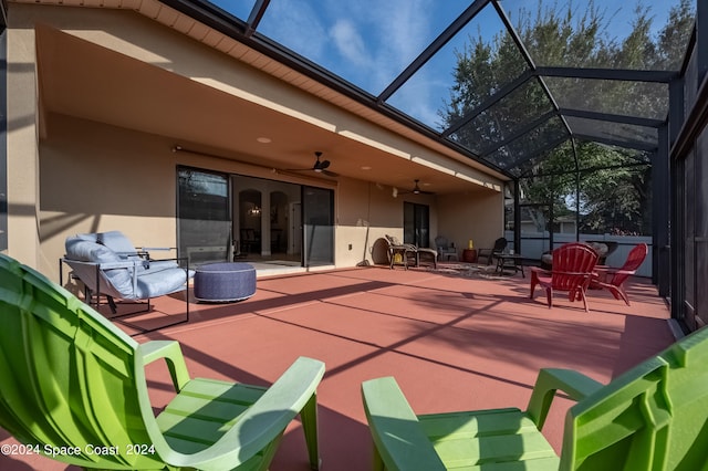 view of patio / terrace with glass enclosure and ceiling fan