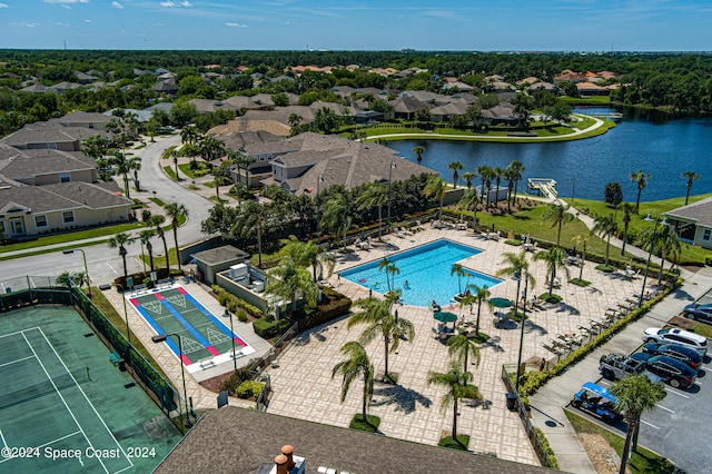 birds eye view of property with a water view