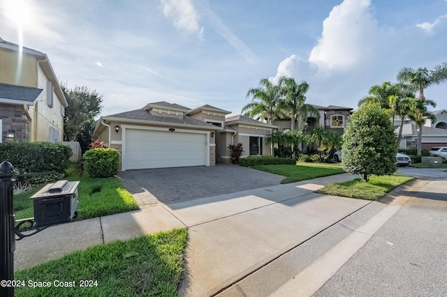 view of front of house featuring a front yard and a garage