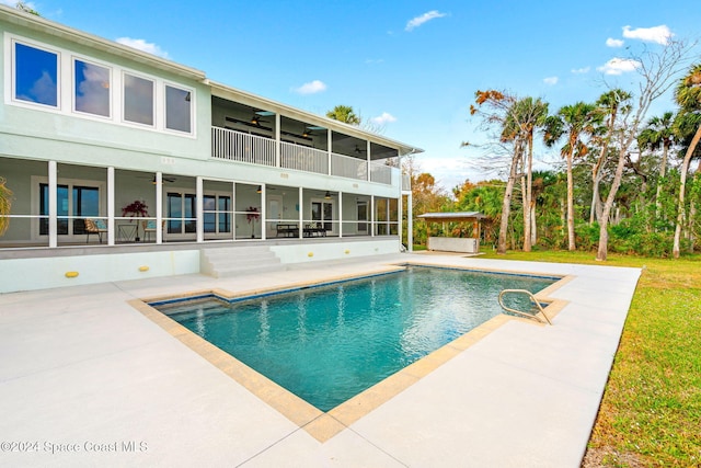 100 Bonita St, Titusville, FL 32780 - swimming pool with a ceiling fan, a patio area, and a sunroom