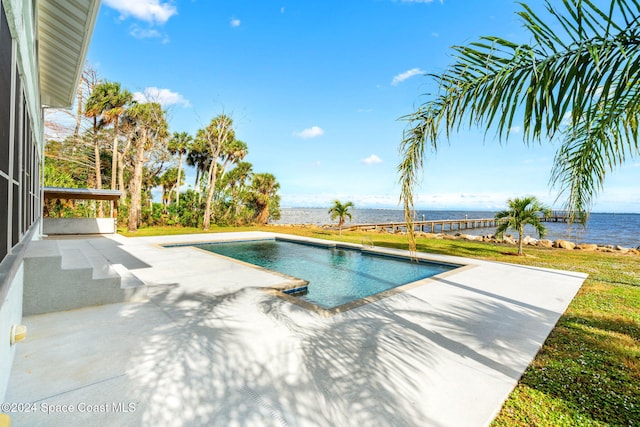 100 Bonita St, Titusville, FL 32780 - swimming pool featuring a patio and a water view