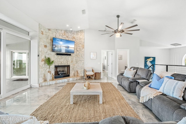 100 Bonita St, Titusville, FL 32780 - living room with a ceiling fan, marble tiled flooring, a stone fireplace, and lofted ceiling