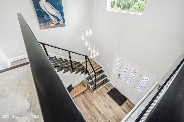 100 Bonita St, Titusville, FL 32780 - stairs featuring wood finished floors and a towering ceiling