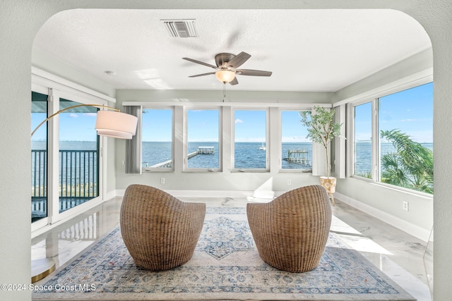 100 Bonita St, Titusville, FL 32780 - sunroom featuring a water view and marble finish flooring