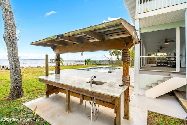 100 Bonita St, Titusville, FL 32780 - view of patio / terrace with a water view and a ceiling fan