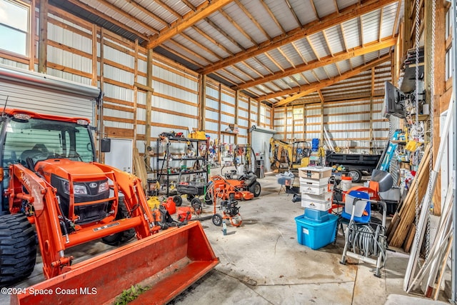 100 Bonita St, Titusville, FL 32780 - garage featuring metal wall and a workshop area