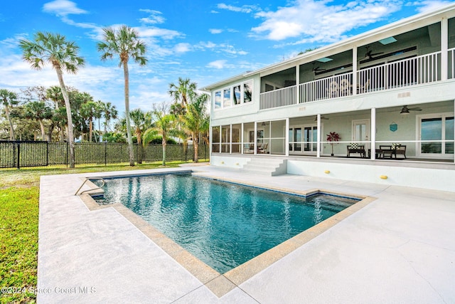 100 Bonita St, Titusville, FL 32780 - view of swimming pool featuring a ceiling fan, a patio, and french doors
