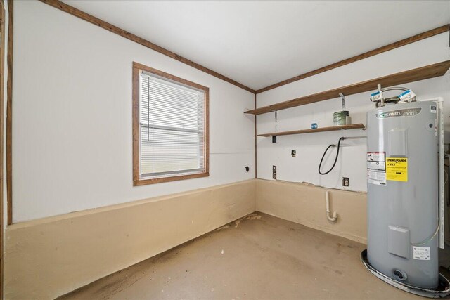 utility room featuring water heater