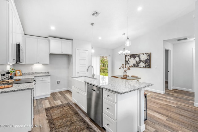 kitchen with light hardwood / wood-style floors, stainless steel dishwasher, white cabinets, decorative light fixtures, and an island with sink