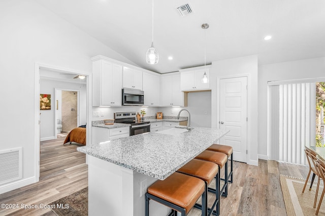 kitchen featuring white cabinets, stainless steel appliances, and sink