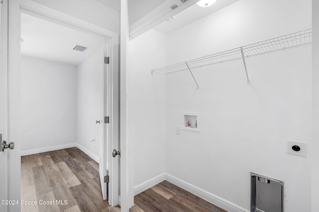 laundry room featuring hookup for a washing machine, electric dryer hookup, and light wood-type flooring