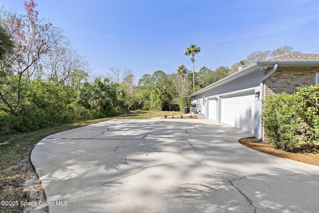 view of property exterior with a garage