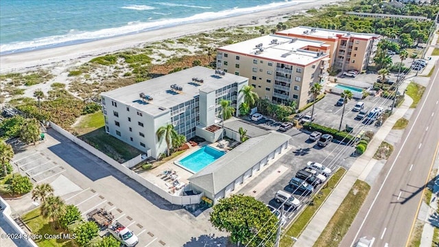 bird's eye view featuring a beach view and a water view