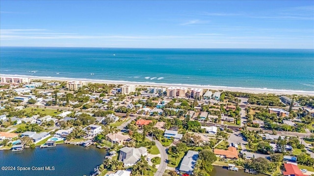 aerial view with a water view and a view of the beach