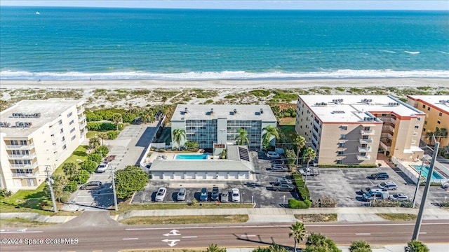 aerial view featuring a water view and a beach view