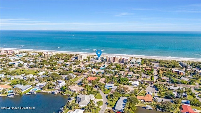 bird's eye view with a water view and a view of the beach