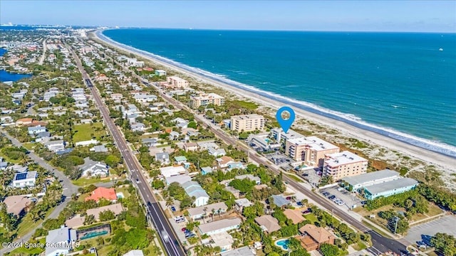 aerial view featuring a view of the beach and a water view