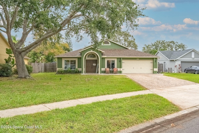 ranch-style house with a garage and a front yard