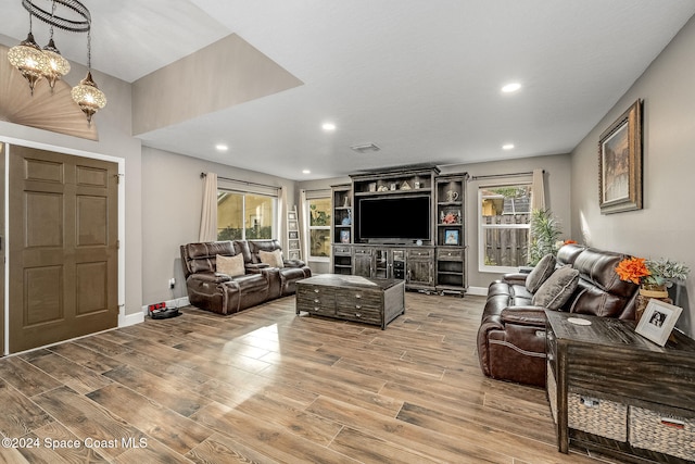 living room with light hardwood / wood-style flooring