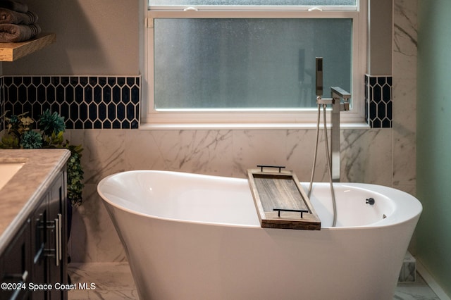 bathroom featuring a bathing tub and vanity