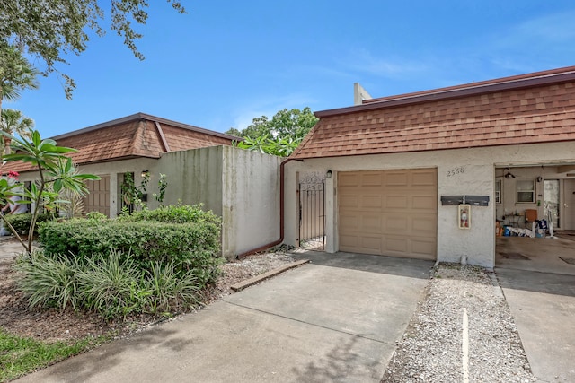 view of side of home featuring a garage