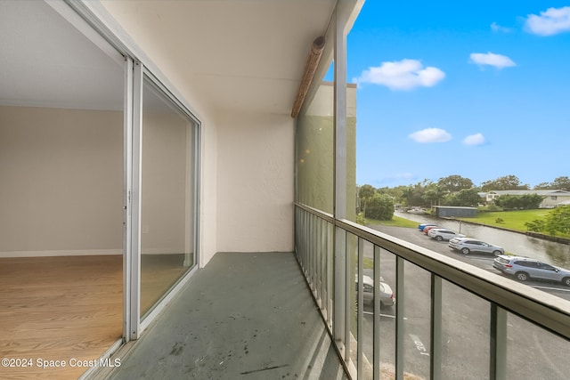 balcony featuring a water view