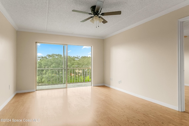 empty room with ceiling fan, ornamental molding, a textured ceiling, and light wood-type flooring