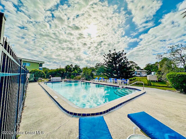 view of swimming pool featuring a patio