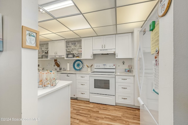 kitchen with white cabinetry, white appliances, sink, and light hardwood / wood-style flooring