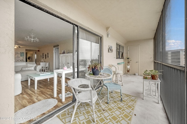 sunroom / solarium featuring a wealth of natural light and ceiling fan