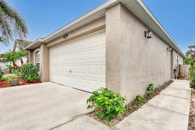 view of side of property featuring a garage